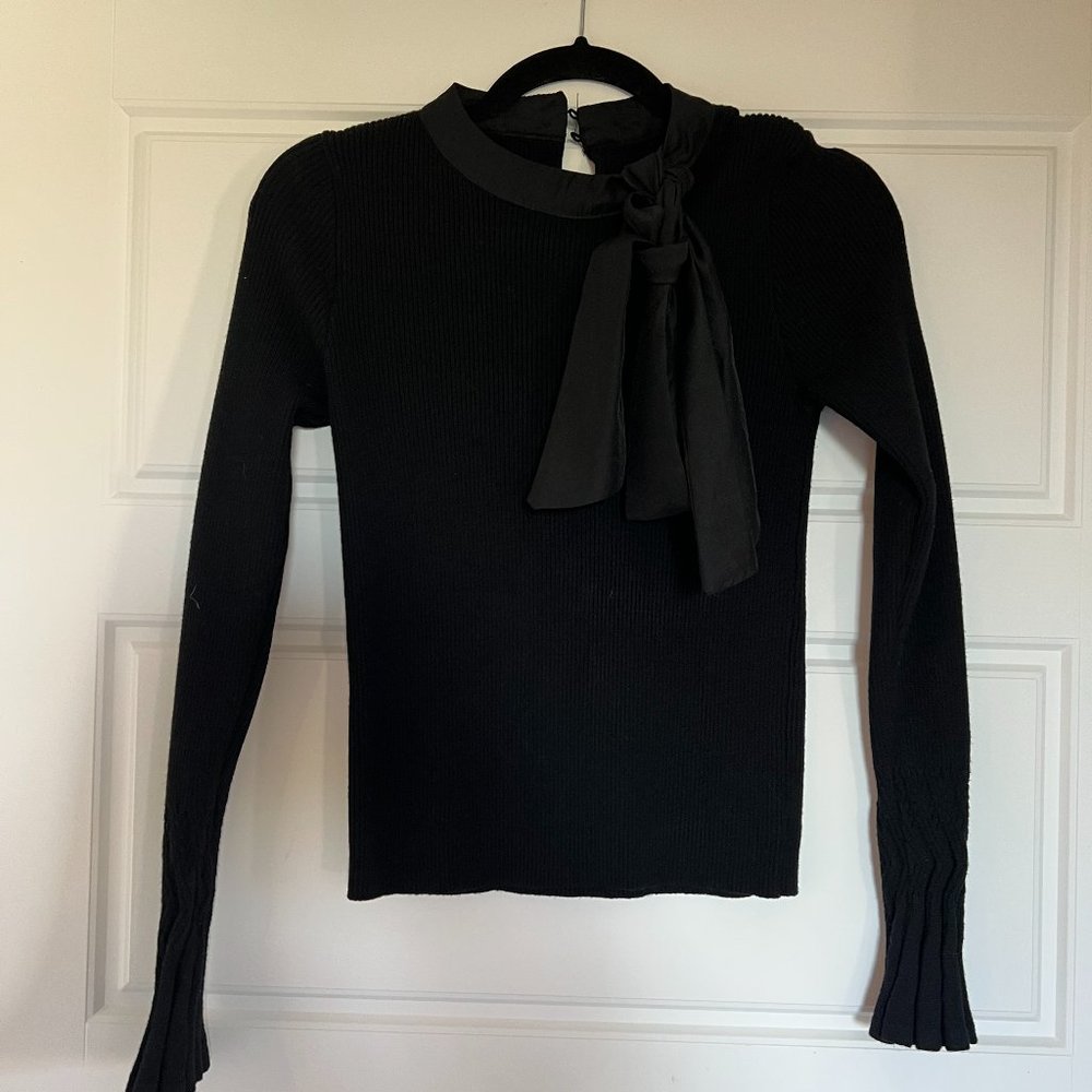 Black top, long sleeves, with bow